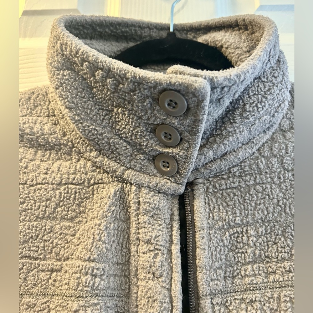 Patagonia women’s full zip jacket with buttoned collar